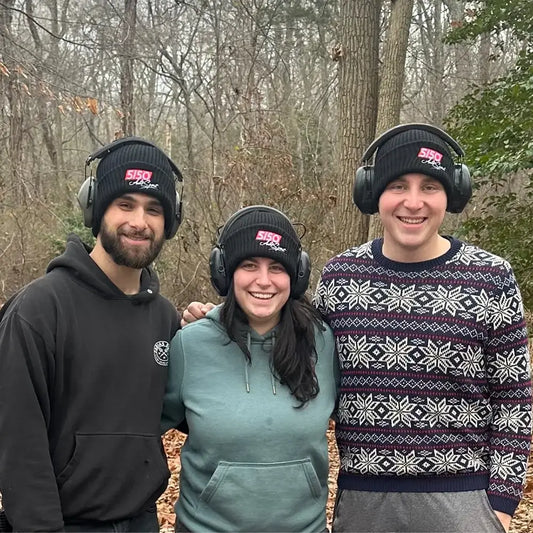Group of young adults wearing black 5150 beanies