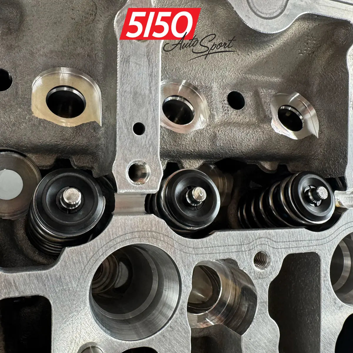 Close-up of BMW S55 cylinder head valves and valve springs showing high performance upgrades